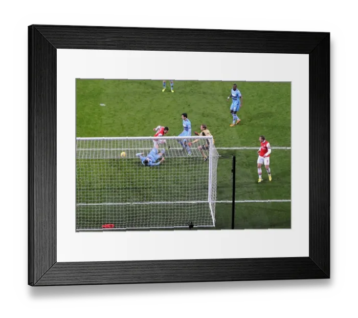 Framed Print : Santi Cazorla Scores Stunning Goal Against West Ham United in Arsenal Victory