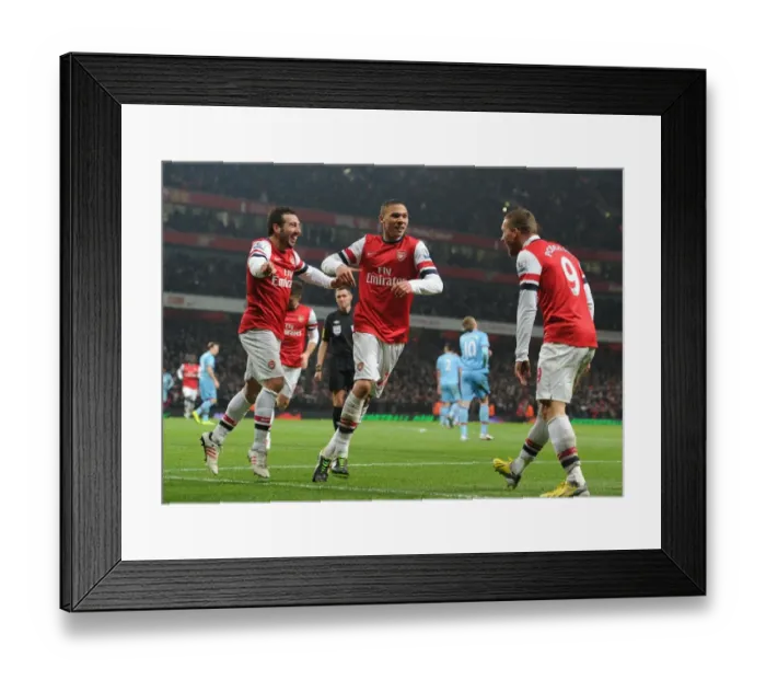 Framed Print : Arsenal's Santi Cazorla Scores, Celebrates with Gibbs and Podolski vs. West Ham United (2013) Framed Print : Arsenal's Santi Cazorla Scores, Celebrates with Gibbs and Podolski vs. West Ham United (2013)