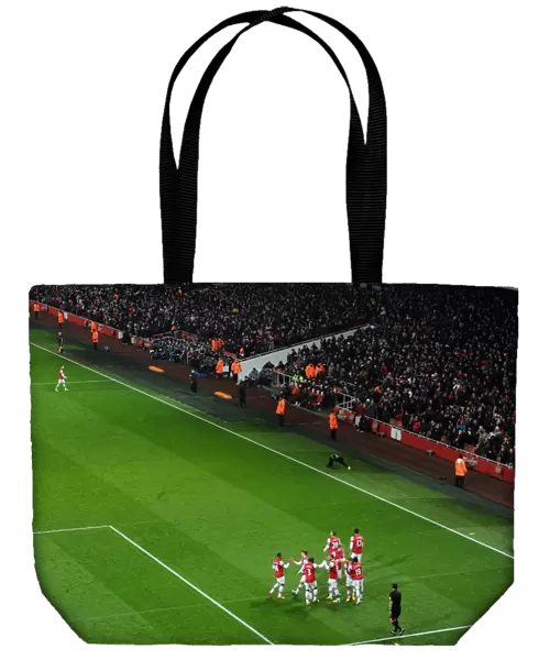 The Arsenal players celebrate the 3rd goal scored by Santi Cazorla. Arsenal 5: 1 West Ham United