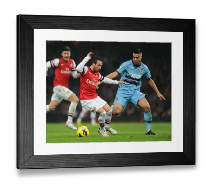 Framed Print : Arsenal's Santi Cazorla Clashes with West Ham's Winston Reid in Premier League Showdown