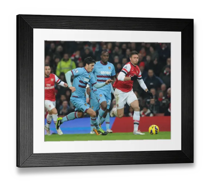 Framed Print : Olivier Giroud Outmaneuvers Guy Demel: Arsenal vs. West Ham United, Premier League 2012-13