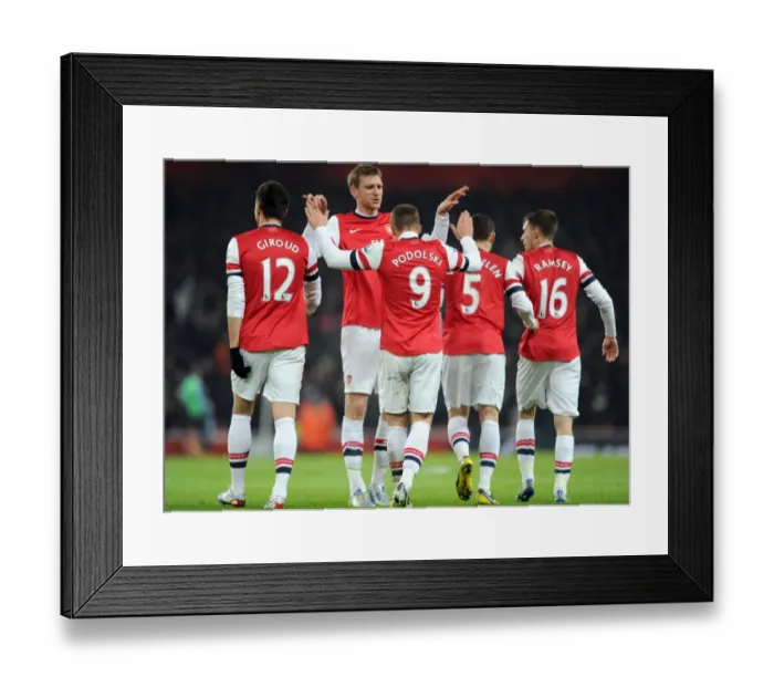 Framed Print : Podolski and Mertesacker Celebrate Arsenal's First Goal vs. West Ham United (2013)