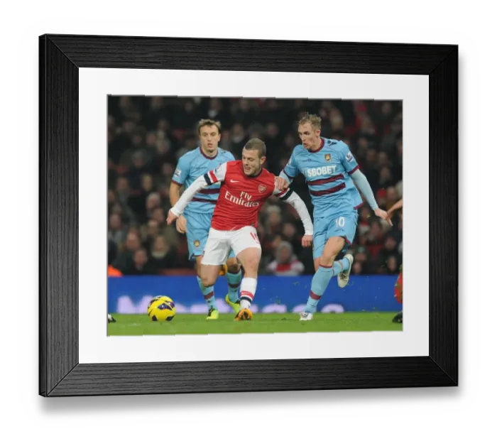 Framed Print : Arsenal's Jack Wilshere Outmaneuvers West Ham's Jack Collison in Premier League Clash Framed Print : Arsenal's Jack Wilshere Outmaneuvers West Ham's Jack Collison in Premier League Clash