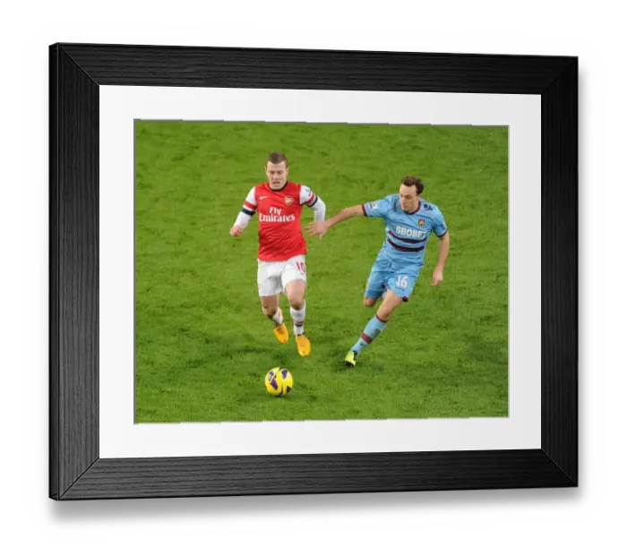 Framed Print : Arsenal's Jack Wilshere Clashes with West Ham's Mark Noble in Premier League Showdown Framed Print : Arsenal's Jack Wilshere Clashes with West Ham's Mark Noble in Premier League Showdown