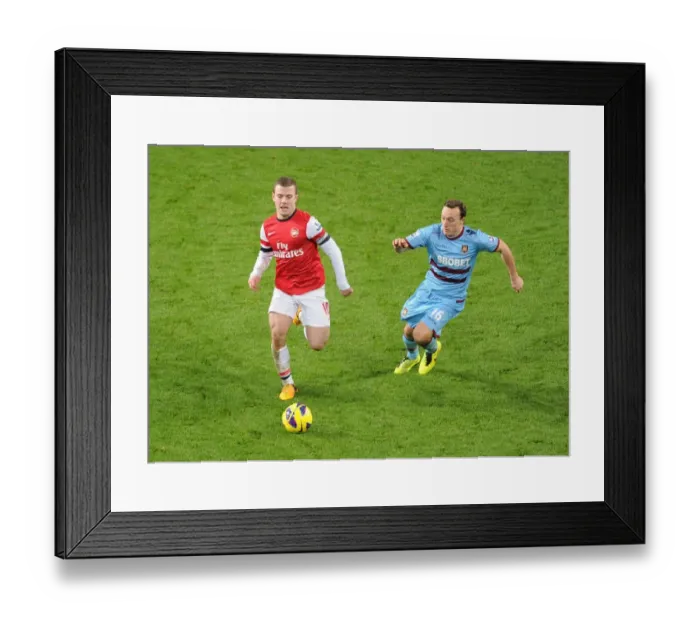 Framed Print : Intense Rivalry: Wilshere vs. Noble - Arsenal vs. West Ham Showdown Framed Print : Intense Rivalry: Wilshere vs. Noble - Arsenal vs. West Ham Showdown