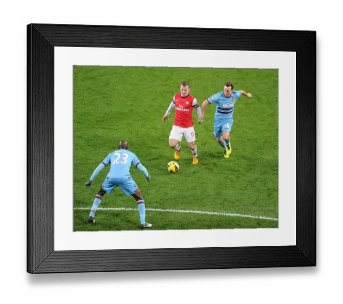 Framed Print : Arsenal's Jack Wilshere Faces Off Against West Ham's Mark Noble and Alou Diarra Framed Print : Arsenal's Jack Wilshere Faces Off Against West Ham's Mark Noble and Alou Diarra