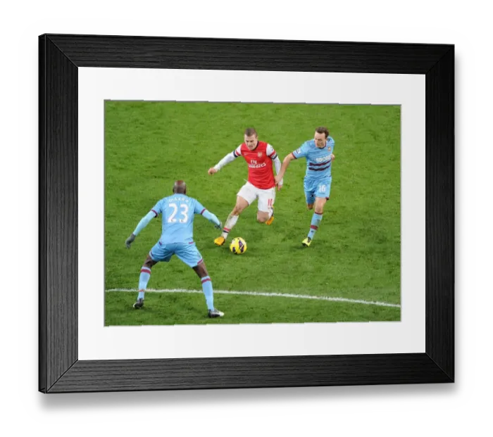 Framed Print : Arsenal's Jack Wilshere Faces Off Against Mark Noble and Alou Diarra of West Ham United Framed Print : Arsenal's Jack Wilshere Faces Off Against Mark Noble and Alou Diarra of West Ham United