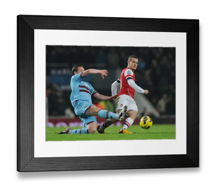 Framed Print : Clash of Midfielders: Wilshere vs. Nolan - Arsenal v West Ham United, Premier League