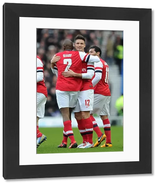 Olivier Giroud celebrates scoring Arsenals 1st goal with Abou Diaby. Brighton & Hove Albion 2