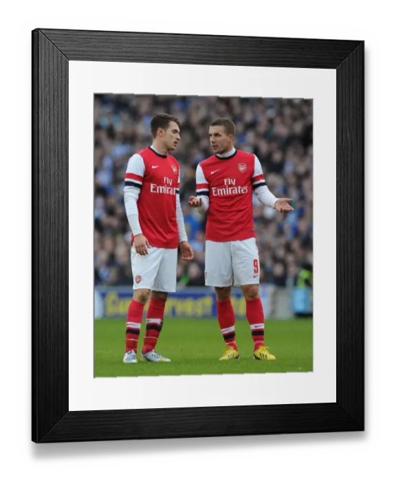 Framed Print : Arsenal Stars Ramsey and Podolski in FA Cup Clash against Brighton & Hove Albion