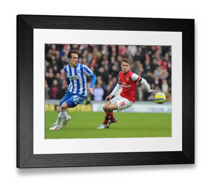 Framed Print : Aaron Ramsey Outmaneuvers David Lopez: FA Cup Clash Between Brighton & Arsenal Framed Print : Aaron Ramsey Outmaneuvers David Lopez: FA Cup Clash Between Brighton & Arsenal