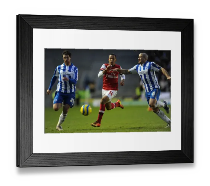 Framed Print : Theo Walcott vs. Wayne Bridge and Adam El-Abd: Intense Battle in FA Cup Match between Brighton & Hove Albion and Arsenal Framed Print : Theo Walcott vs. Wayne Bridge and Adam El-Abd: Intense Battle in FA Cup Match between Brighton & Hove Albion and Arsenal