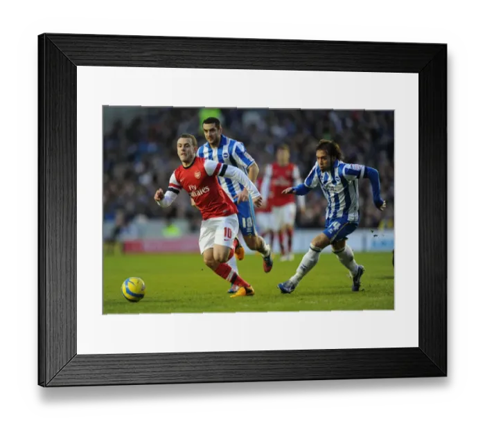 Framed Print : Arsenal's Jack Wilshere Goes Head-to-Head with Brighton's Gary Dicker and Inigo Calderon in FA Cup Showdown