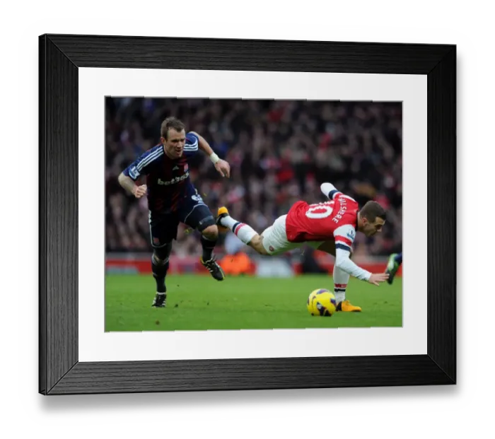 Framed Print : Wilshere vs. Whelan: A Midfield Battle at Arsenal vs. Stoke City, Premier League 2012-13