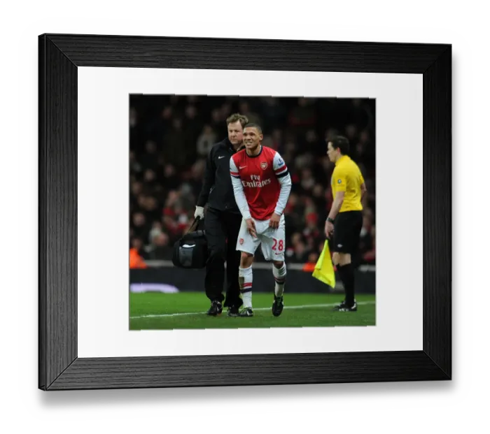 Framed Print : Arsenal's Kieran Gibbs Receives Treatment from Physio Colin Lewin during Arsenal v Liverpool Match