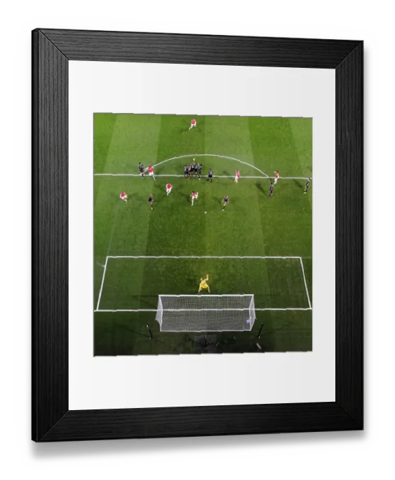 Framed Print : Lukas Podolski (Arsenal) free kick hits the Liverpool wall. Arsenal 2: 2 Liverpool