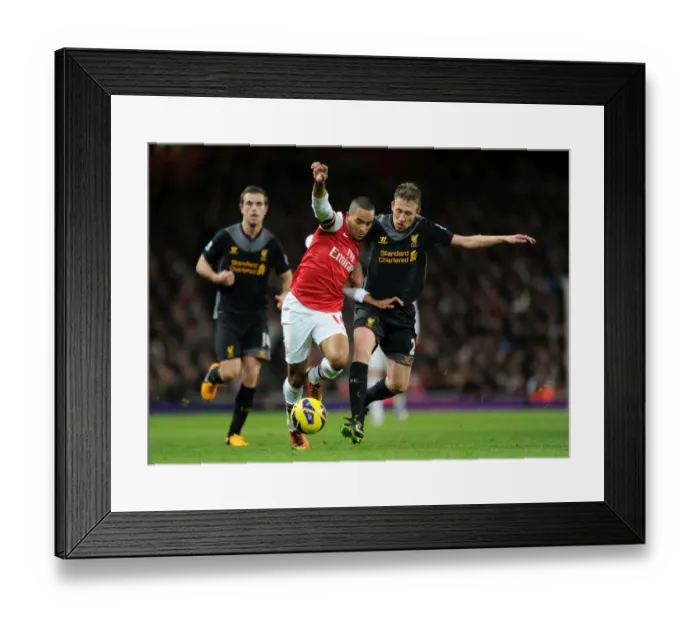 Framed Print : Theo Walcott vs. Lucas Leiva: Intense Battle at Arsenal v Liverpool, Premier League 2012-13 Framed Print : Theo Walcott vs. Lucas Leiva: Intense Battle at Arsenal v Liverpool, Premier League 2012-13