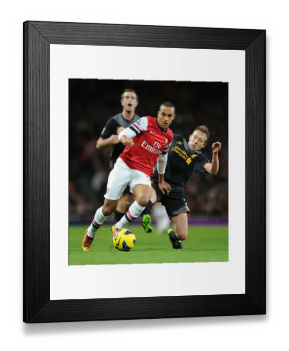 Framed Print : Theo Walcott vs. Lucas Leiva: A Premier League Battle at the Emirates Framed Print : Theo Walcott vs. Lucas Leiva: A Premier League Battle at the Emirates