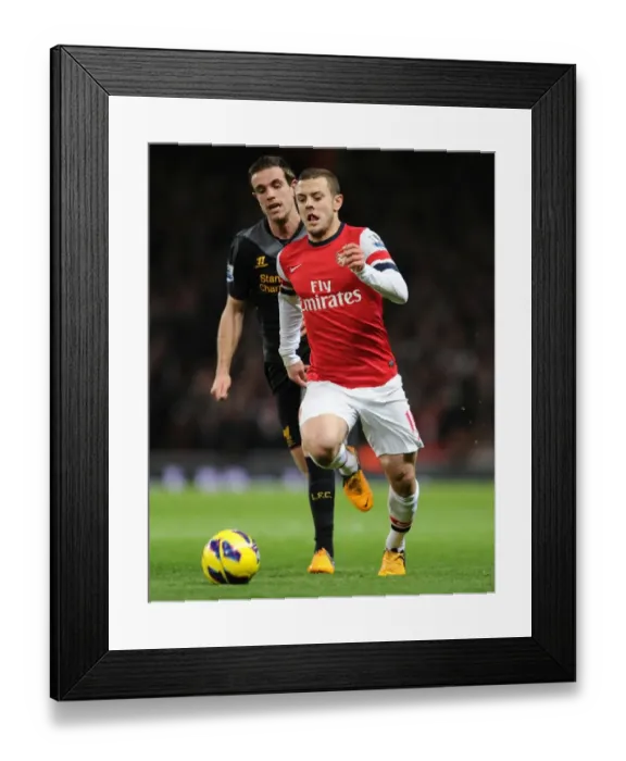 Framed Print : Jack Wilshere vs. Jordan Henderson: Intense Rivalry on the Arsenal v Liverpool Field (2012-13)