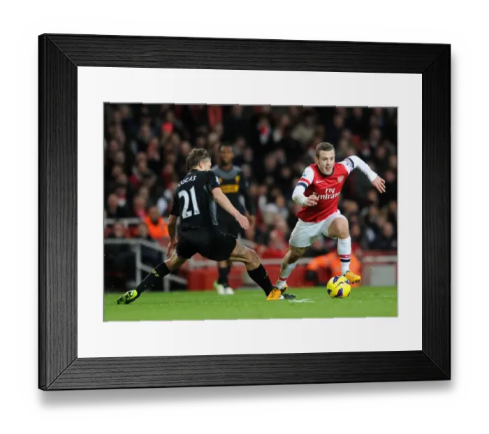 Framed Print : Arsenal's Jack Wilshere Evades Liverpool's Lucas Leiva During Intense Premier League Clash