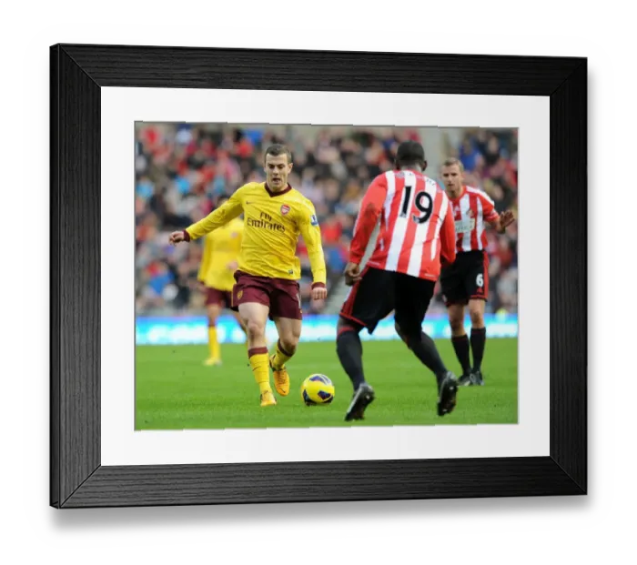 Framed Print : Jack Wilshere vs. Titus Bramble: Battle on the Football Field (Sunderland vs. Arsenal, 2012-13)