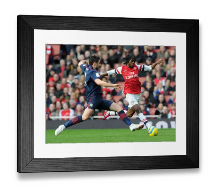 Framed Print : Gervinho vs. Bradley Orr: A Battle in the FA Cup Fifth Round Between Arsenal and Blackburn Rovers Framed Print : Gervinho vs. Bradley Orr: A Battle in the FA Cup Fifth Round Between Arsenal and Blackburn Rovers