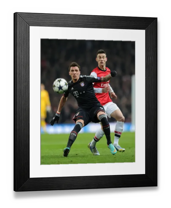 Framed Print : Arsenal vs. Bayern Munich: Koscielny vs. Mandzukic in Champions League Showdown