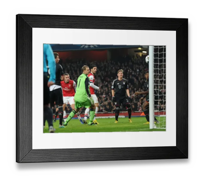 Framed Print : Podolski's Stunning Header: Arsenal's Shocking Upset Against Neuer and Alaba in the Champions League, 2012-13