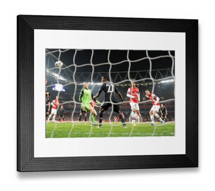 Framed Print : Lukas Podolski's Epic Header: Arsenal's Stunning Upset Against Bayern Munich in the Champions League (Manuel Neuer, David Alaba) Framed Print : Lukas Podolski's Epic Header: Arsenal's Stunning Upset Against Bayern Munich in the Champions League (Manuel Neuer, David Alaba)