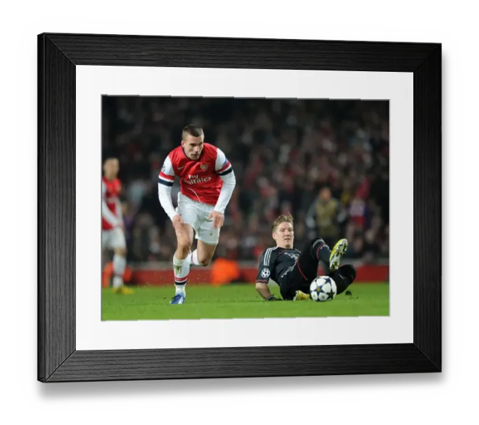 Framed Print : Lukas Podolski vs. Bastian Schweinsteiger: A Battle in the Arsenal v Bayern Munich UEFA Champions League Clash Framed Print : Lukas Podolski vs. Bastian Schweinsteiger: A Battle in the Arsenal v Bayern Munich UEFA Champions League Clash