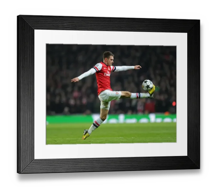 Framed Print : Arsenal's Aaron Ramsey Faces Off Against Bayern Munchen in the UEFA Champions League (2013) Framed Print : Arsenal's Aaron Ramsey Faces Off Against Bayern Munchen in the UEFA Champions League (2013)