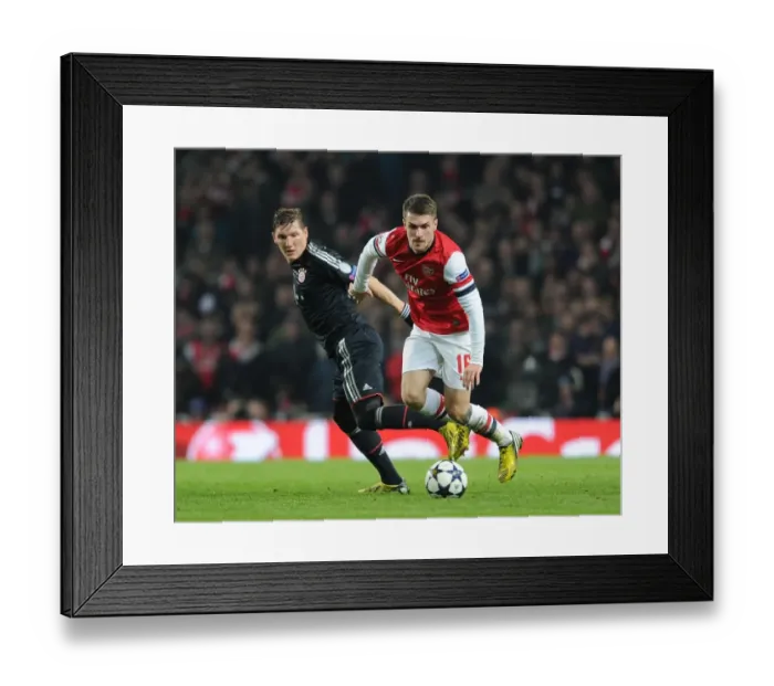 Framed Print : Clash of Titans: Ramsey vs. Schweinsteiger - Arsenal v Bayern Munich, UEFA Champions League 2013