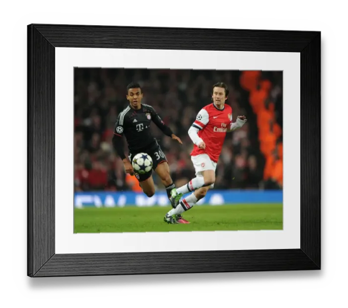 Framed Print : Arsenal's Rosicky Evades Bayern's Gustavo in Champions League Clash