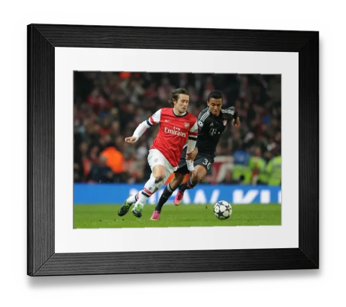 Framed Print : Arsenal's Tomas Rosicky Outmaneuvers Bayern Munchen's Luiz Gustavo in Champions League Clash Framed Print : Arsenal's Tomas Rosicky Outmaneuvers Bayern Munchen's Luiz Gustavo in Champions League Clash
