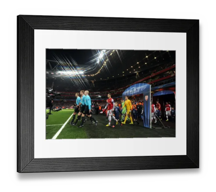 Framed Print : Thomas Vermaelen Leads Arsenal Out Against Bayern Munchen in Champions League Showdown Framed Print : Thomas Vermaelen Leads Arsenal Out Against Bayern Munchen in Champions League Showdown