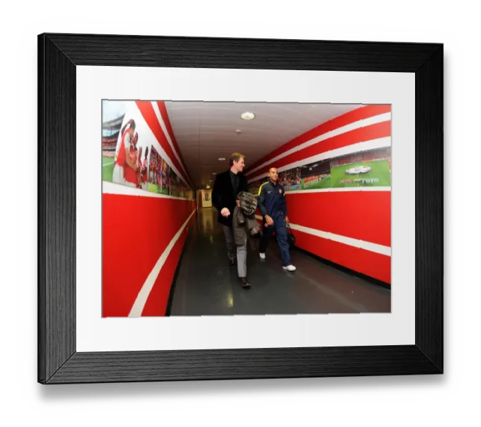 Framed Print : Theo Walcott (Arsenal) walks in with former Arsenal Player Jens Lehmann. Arsenal 1: 3 Bayern Munich