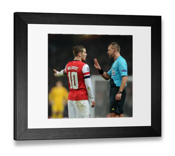 Framed Print : Arsenal's Jack Wilshere Argues with Referee Svein Oddvar Moen during Arsenal v Bayern Munich UEFA Champions League Match Framed Print : Arsenal's Jack Wilshere Argues with Referee Svein Oddvar Moen during Arsenal v Bayern Munich UEFA Champions League Match