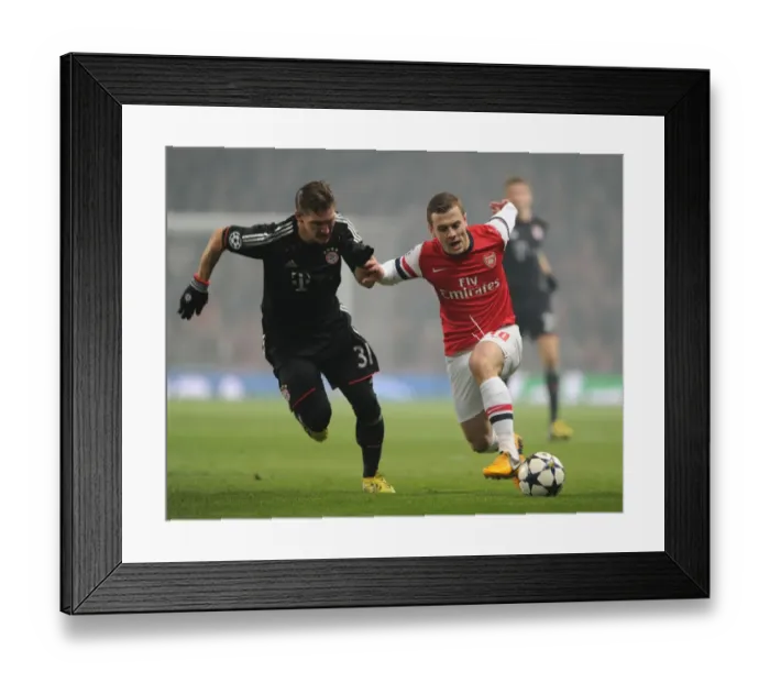 Framed Print : Clash of Midfield Titans: Wilshere vs Schweinsteiger (Arsenal vs Bayern Munich, 2013)