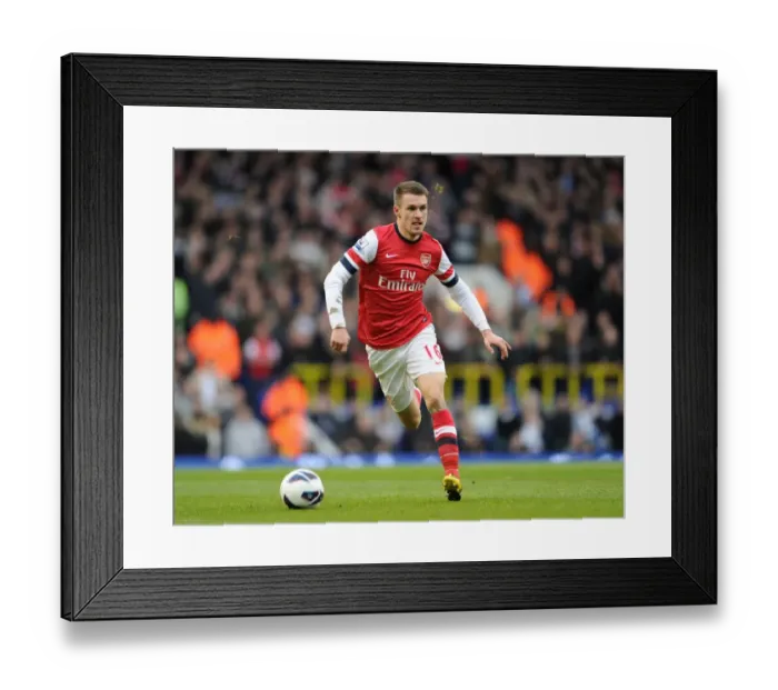 Framed Print : Aaron Ramsey (Arsenal). Tottenham Hotspur 2: 1 Arsenal. Barclays Premier League. White Hart Lane