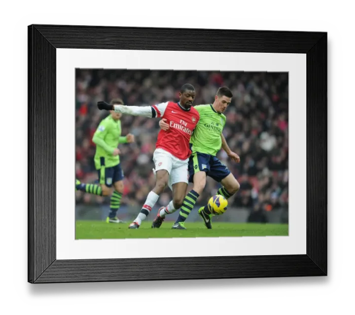 Framed Print : Arsenal vs. Aston Villa: Abou Diaby and Ciaran Clark's Intense Clash on the Emirates Field Framed Print : Arsenal vs. Aston Villa: Abou Diaby and Ciaran Clark's Intense Clash on the Emirates Field