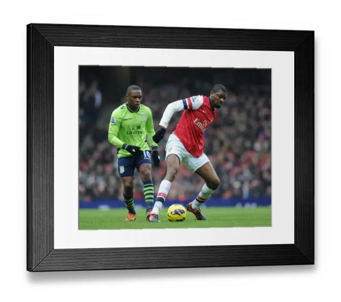 Framed Print : Clash at Emirates: A Football Battle - Abou Diaby vs. Charles N'Zogbia Framed Print : Clash at Emirates: A Football Battle - Abou Diaby vs. Charles N'Zogbia