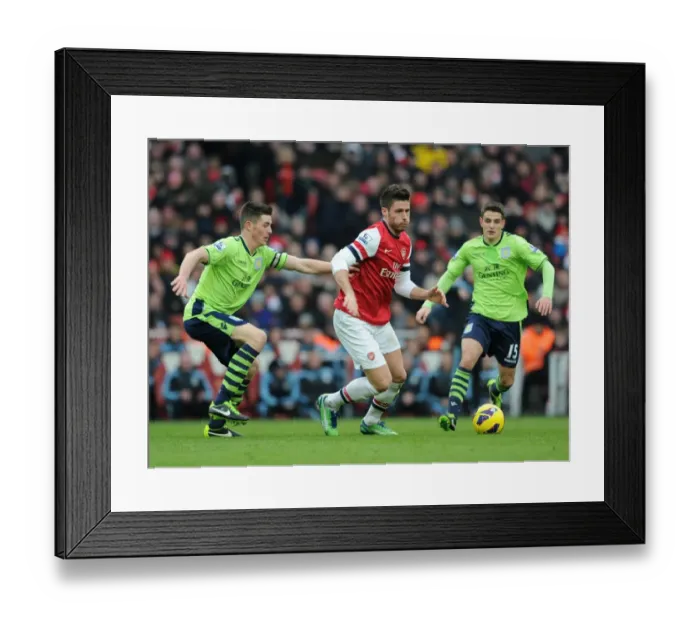 Framed Print : Arsenal's Olivier Giroud Fends Off Aston Villa's Defenders During Premier League Clash