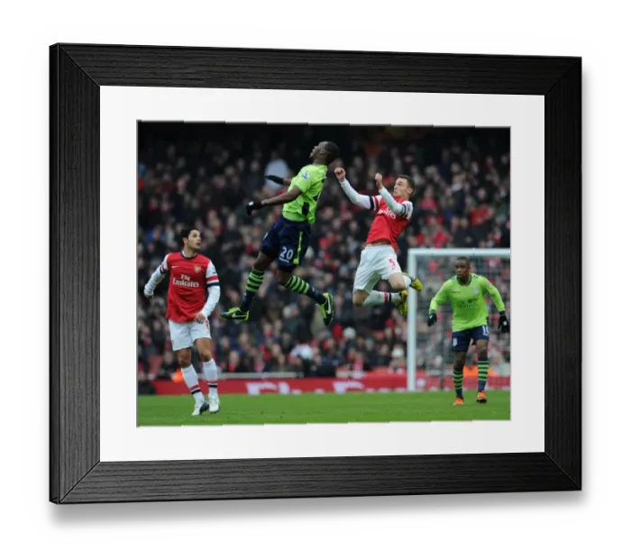 Framed Print : Thomas Vermaelen (Arsenal) Christian Benteke (Villa). Arsenal 2: 1 Aston Villa. Barclays Framed Print : Thomas Vermaelen (Arsenal) Christian Benteke (Villa). Arsenal 2: 1 Aston Villa. Barclays