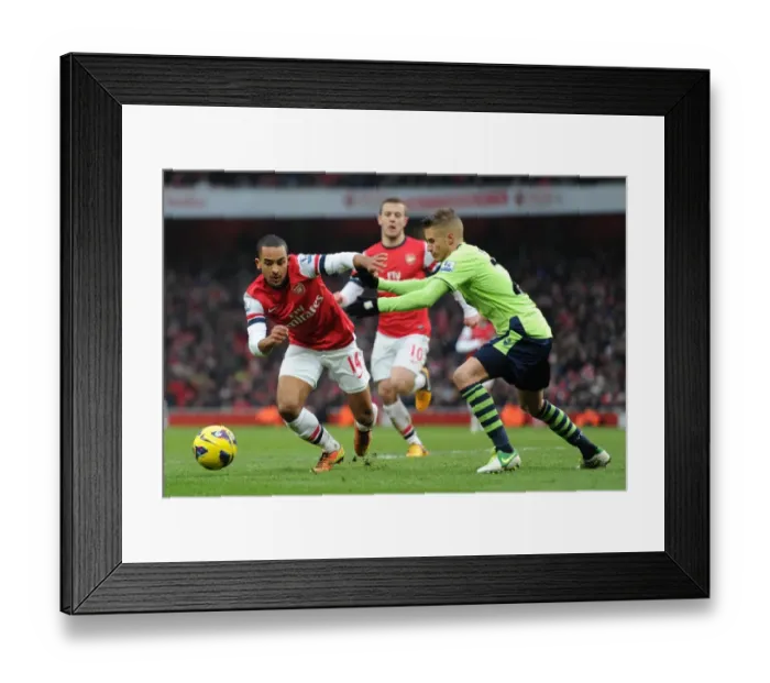 Framed Print : Theo Walcott (Arsenal) Joe Bennett (Villa). Arsenal 2: 1 Aston Villa. Barclays Premier League Framed Print : Theo Walcott (Arsenal) Joe Bennett (Villa). Arsenal 2: 1 Aston Villa. Barclays Premier League