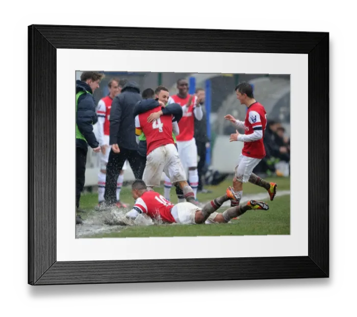 Framed Print : Serge Gnabry's Euphoric Goal Slide: Arsenal U19 vs Inter Milan U19, NextGen Series 2012-13