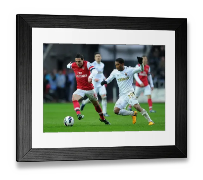 Framed Print : Clash of Midfield Maestros: Santi Cazorla vs. Jonathan De Guzman (Swansea City vs. Arsenal, 2012-13)