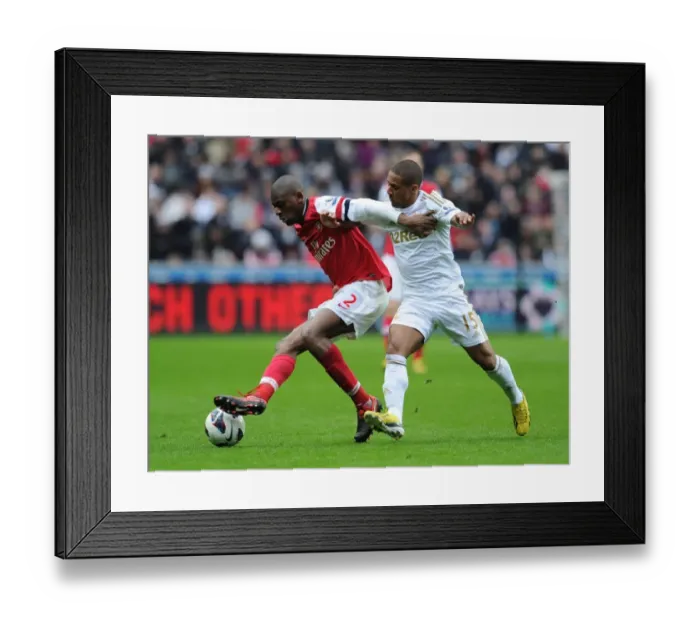 Framed Print : Abou Diaby vs Ashley Williams: Intense Battle at Swansea City vs Arsenal (2012-13)