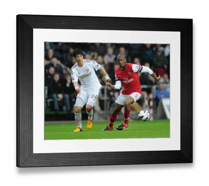 Framed Print : Abou Diaby Outmaneuvers Ki Sung-Yueng: Swansea City vs. Arsenal, Premier League, 2012-2013 Framed Print : Abou Diaby Outmaneuvers Ki Sung-Yueng: Swansea City vs. Arsenal, Premier League, 2012-2013