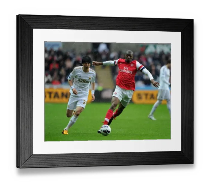 Framed Print : Abou Diaby Outmaneuvers Ki Sung-Yueng: Premier League Battle at Swansea City, 2012-13 Framed Print : Abou Diaby Outmaneuvers Ki Sung-Yueng: Premier League Battle at Swansea City, 2012-13