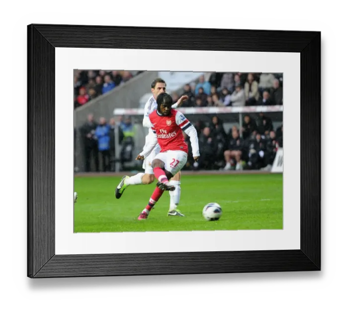 Framed Print : Gervinho Scores Against Angel Rangel: Swansea City vs. Arsenal, Premier League, 2013